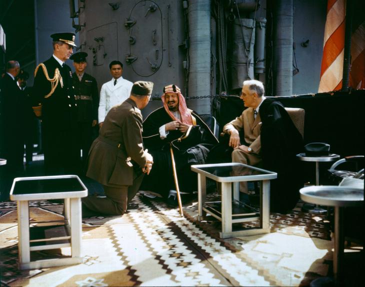 President Franklin D Roosevelt and King Ibn Sa‘ūd on board USS Quincy (CA-71) in February 1945. Public Domain