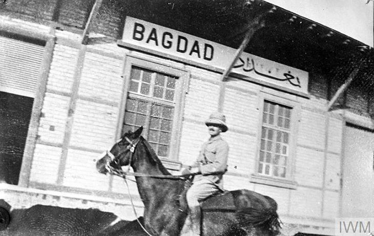 A British officer on horseback photographed outside the Baghdad terminus of the Berlin-Baghdad railway, 1917. Imperial War Museum, London. © IWM Q 25195